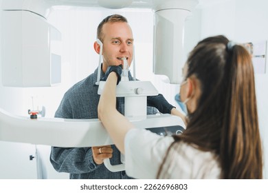 A young man underwent a CT scan of the jaw, a circular image of the jaw in modern dentistry. Radiology, panoramic scanner.