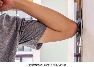 The Young Man Uses An Elbow To Press The Elevator Button To Prevent The Spread Of The Covid 19 Or Corona Virus