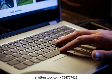 Young man uses laptop to electronically pay bills with his credit card - Shutterstock ID 784707412