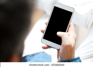 Young Man Using Cell Phone, Shallow Depth Of Field