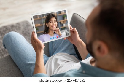 Young Man Using Digital Tablet For Video Chat With His Girlfriend While Relaxing On Couch At Home, Millennial Couple Talking Online Via Web Call, Enjoying Virtual Communiction, Creative Collage