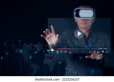 Young Man Using Glasses Of Virtual Reality On Dark Background. Smartphone Using With VR Headset,virtual Reality,future Technology Concept.VDO Simulation ,cyber Security ,network Security