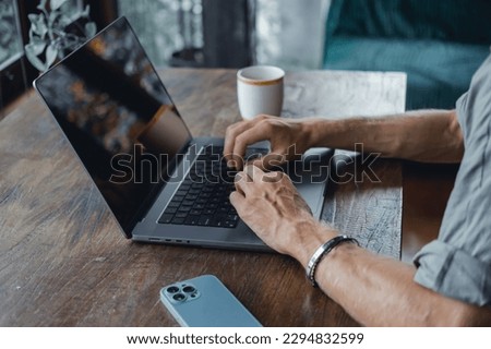 Young man using laptop in cafe, outdoor portrait business man, hipster style, internet, smartphone, office, Bali Indonesia, holding, mac OS, manager, freelancer , notebook
glass, coffee cup, meeting