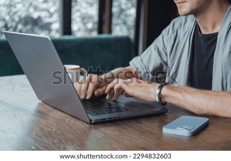 Young man using laptop in cafe, outdoor portrait business man, hipster style, internet, smartphone, office, Bali Indonesia, holding, mac OS, manager, freelancer , notebook
glass, coffee cup, meeting 