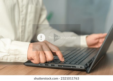 Young man using a laptop computer to play social media but this video is blocked or privacy settings have been set. Searching for more internet, search engine optimization.