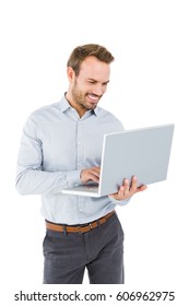 Young Man Using Laptop On White Background