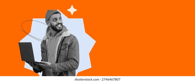 Young Man Using Laptop While Smiling in a Bright Orange Background