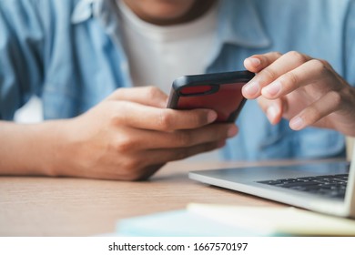 Young man using mobile phone. Using online connect technology for business, education and communication. 