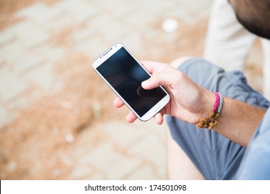 Young Man Using Mobile Smart Phone