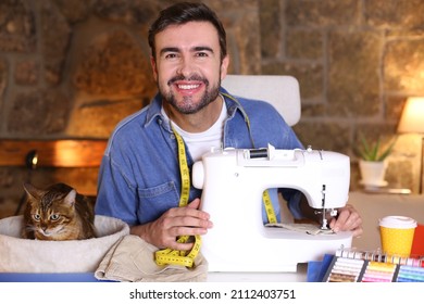 Young Man Using Sewing Machine