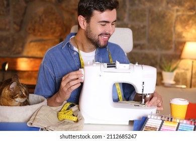 Young Man Using Sewing Machine