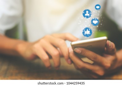 Young man using smart phone,Social media concept. - Shutterstock ID 1044259435