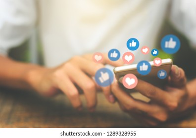 Young man using smart phone,Social media concept. - Shutterstock ID 1289328955