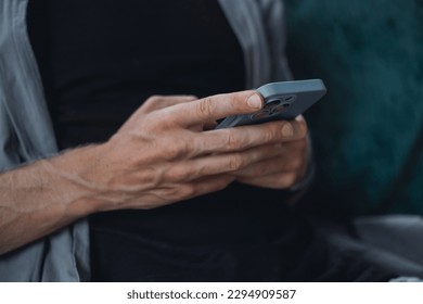 Young man using smartphone in hand, cafe, office,outdoor portrait business man, hipster style, internet, smartphone, office, Bali Indonesia, holding, mac OS, manager, freelancer, concept
