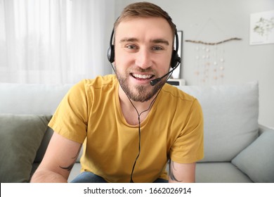 Young Man Using Video Chat At Home