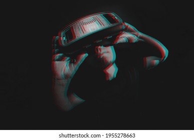 Young man using virtual reality headset VR. education online, studying concept. Black and white with 3D glitch virtual reality effect