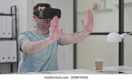 Young Man Using VR Head Set