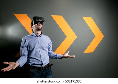 young man using VR virtual reality glasses headset