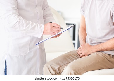 Young Man Visiting Urologist In Clinic