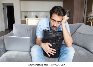 Young Man Vomiting In Rubbish Bin After Exhausting Busy Work Day