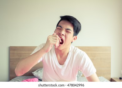 Young Man Wake Up And Yawn