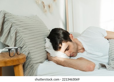 A Young Man Wakes Up From The First Ray Of The Sun.