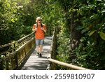 Young man walking along the walkways on the way to Devil