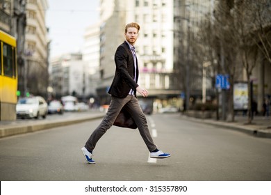 Young Man Walking On The Street