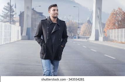 Young Man Walking On Street, Autumn Or Winter Cold Day. Outdoors, Outside.
Gorgeous Guy In Coat