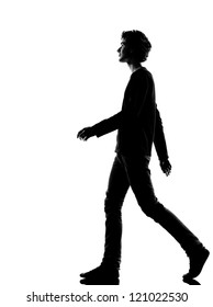 Young Man Walking Silhouette In Studio Isolated On White Background