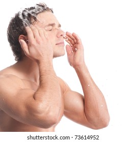 Young Man Wash Face. Water Drop And Spash