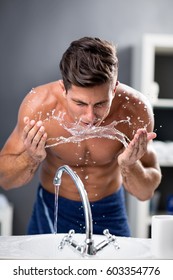 
Young Man Washing Face With Clean Water, Morning Hygiene