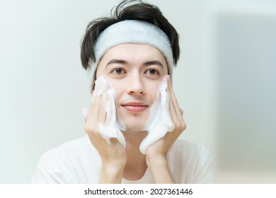 Young Man Washing His Face