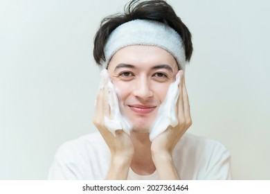 Young Man Washing His Face