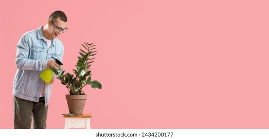 Young man watering plant with money on pink background with space for text. Concept of business growth - Powered by Shutterstock