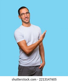 Young Man Waving With His Hand