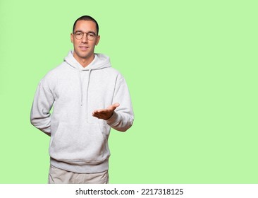 Young Man Waving With His Hand