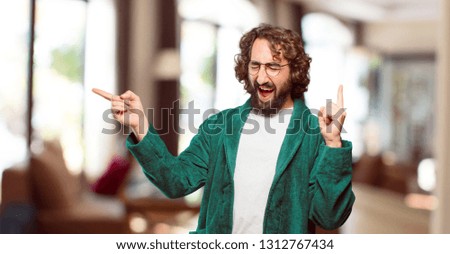 young man wearing bathrobe night suit victory sign