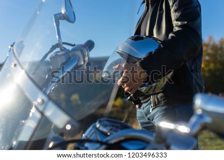 Similar – Senior man repairing damaged motorcycle engine