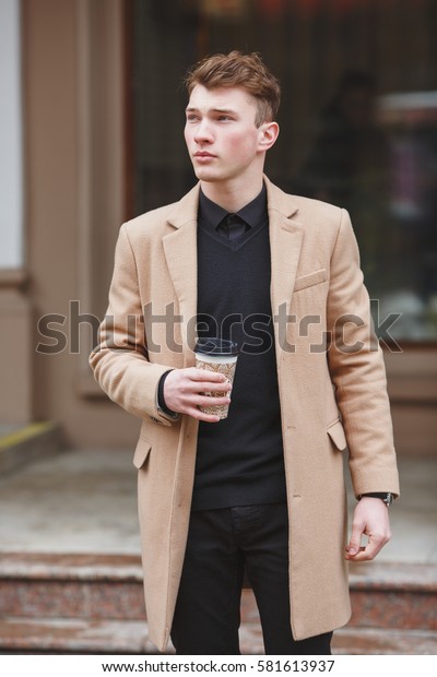 brown coat pant with black shirt
