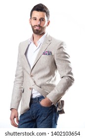 A Young Man Wearing A Blazer In Blue Jeans On A White Background