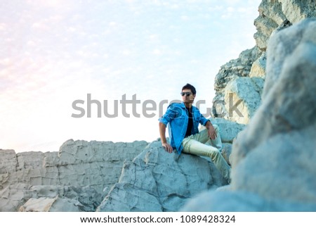 Similar – black haired man posing with sunglasses