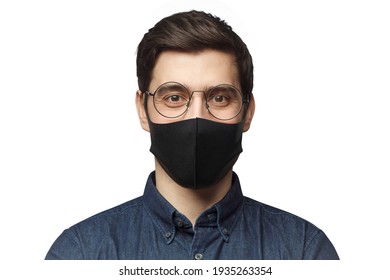 Young Man Wearing Denim Shirt, Round Glasses And Black Mask Standing Isolated On Gray Background