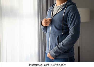 Young Man Wearing A Jacket, Man Holding A Jacket Zip