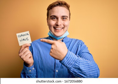 Young Man Wearing Medical Security Mas Holding Paper Note Reminder With Coronavirus Alert Word Very Happy Pointing With Hand And Finger