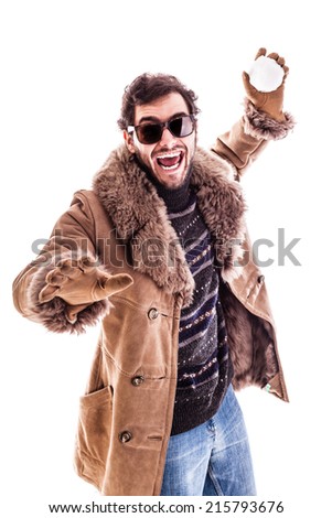 a young man wearing a sheepskin coat isolated over a white background playing with a snowball