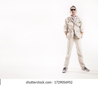 A Young Man Wearing Sunglasses And White Suit