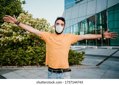 
Young Man Wearing Surgical Mask To Protect Himself From The Covid19 Virus, Excited To See Someone For The First Time After Many Days Of Quarantine At Home. New Normal