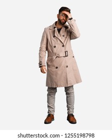 Young Man Wearing Trench Coat Forgetful, Realize Something