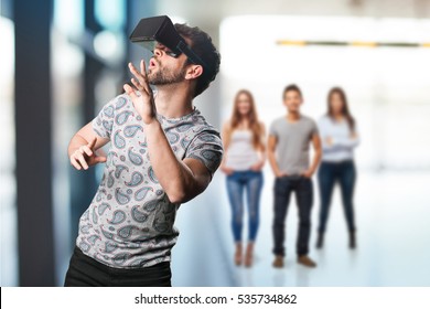 young man wearing a virtual reality glasses - Powered by Shutterstock